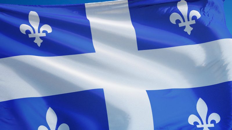 quebec-flag-waving-against-clean-blue-sky-close-up-isolated-with-clipping-path-m_16x9_WEB-800x...jpg